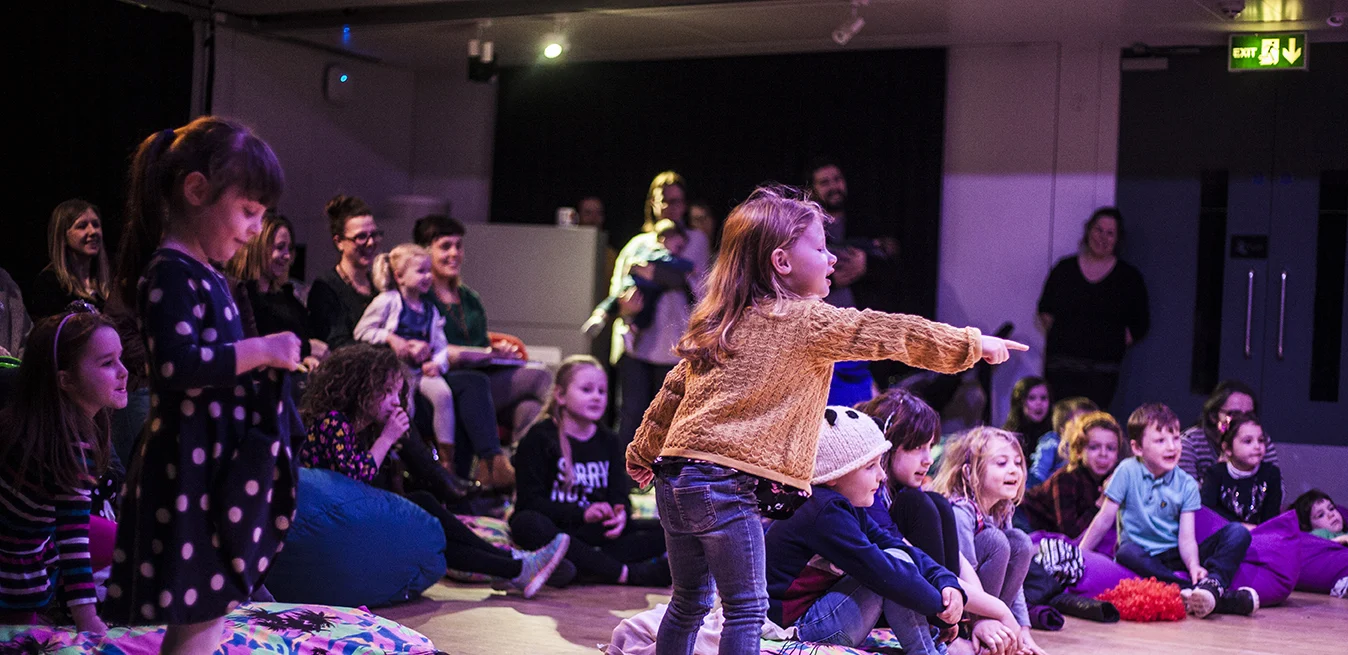 Kids watching a show